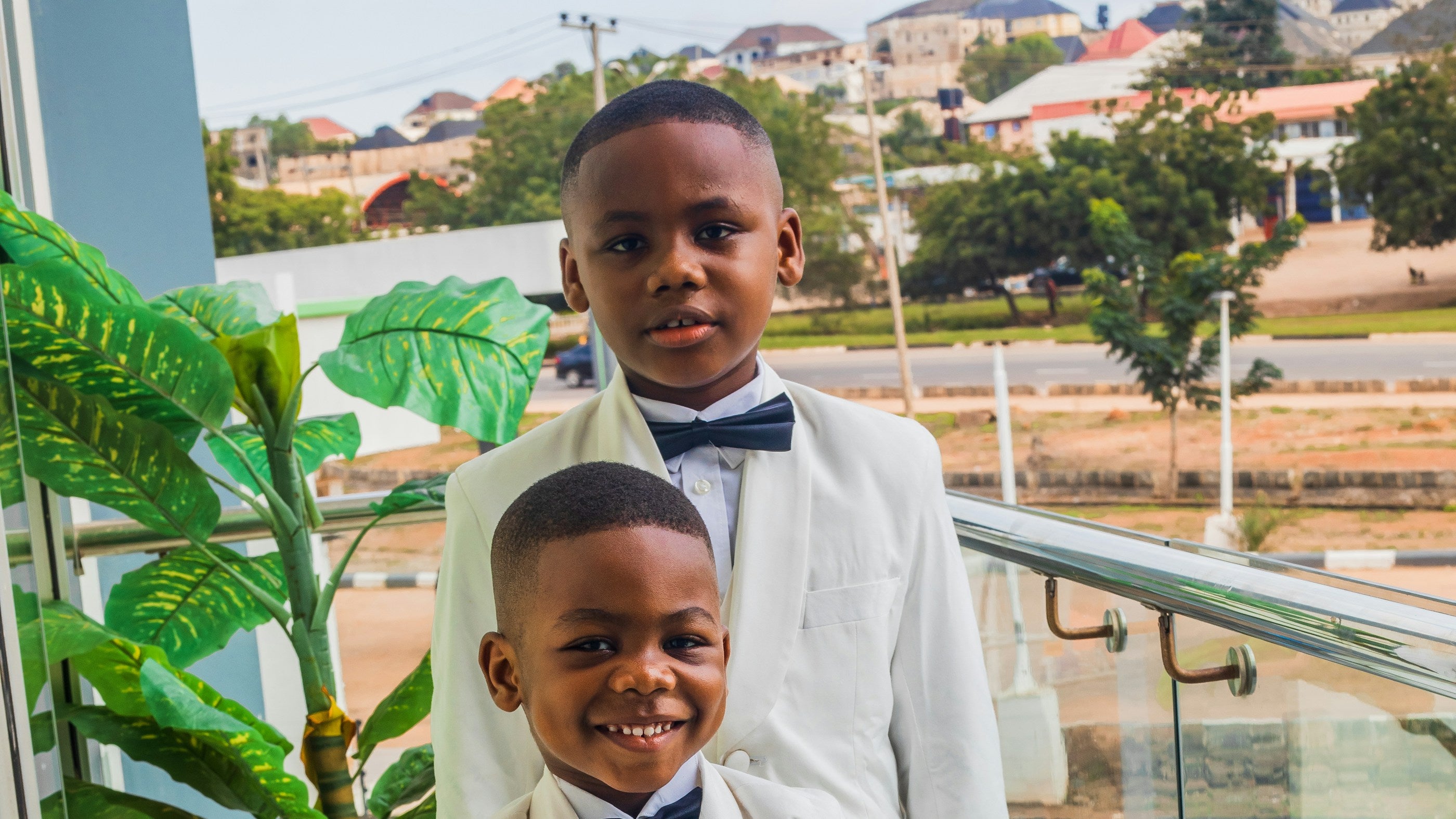 Two young boys in formal suits