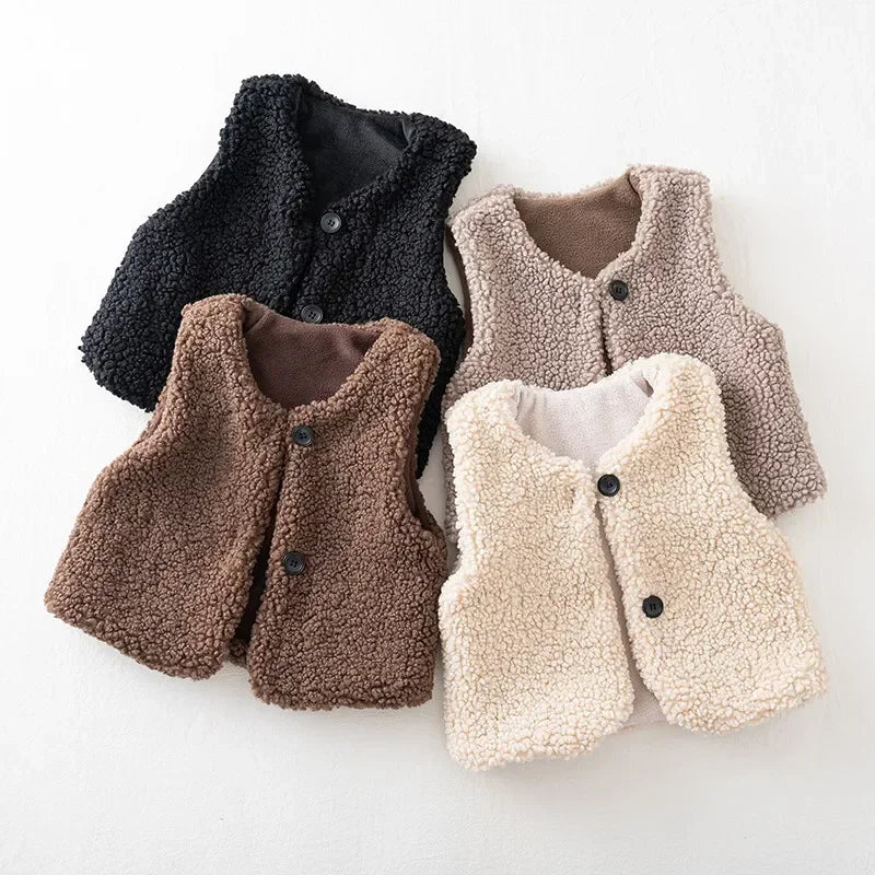 Toddler boy wearing a plush sherpa vest